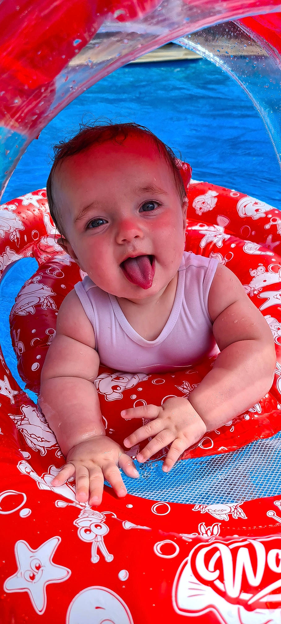 Knox is registered to the contest to win money with this photo: baby, baby_toddler_clothing, blue, cheek, child, face, facial_expression, fun, happy, leisure, person, photograph, pink, product, red, skin, sleeve, smile, summer, toddler