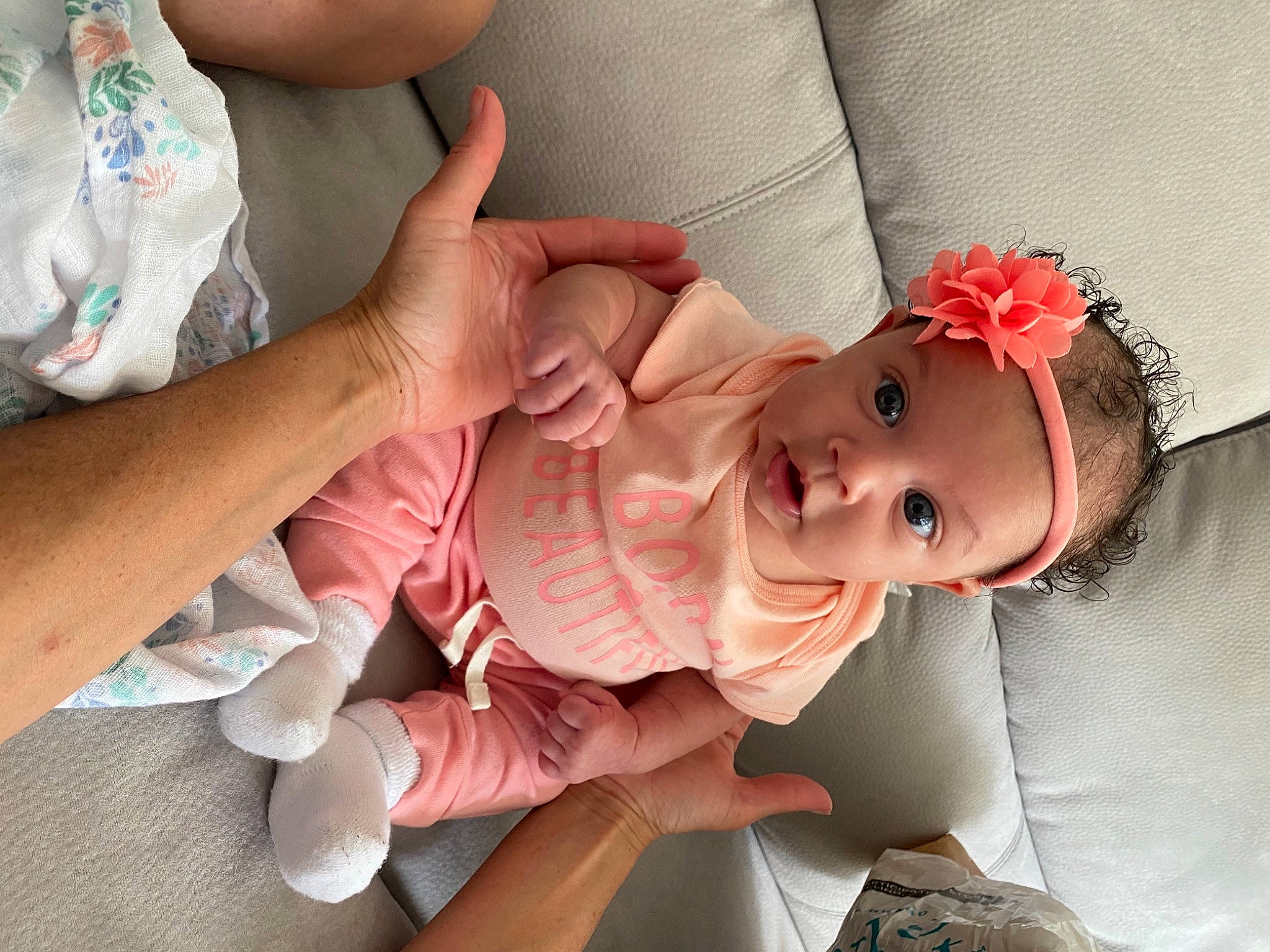 Sorraya is registered to the contest to win money with this photo: baby, baby_toddler_clothing, cheek, child, comfort, dress, face, finger, flower, gesture, hand, happy, hat, human_body, lip, mouth, nail, person, skin, surprise