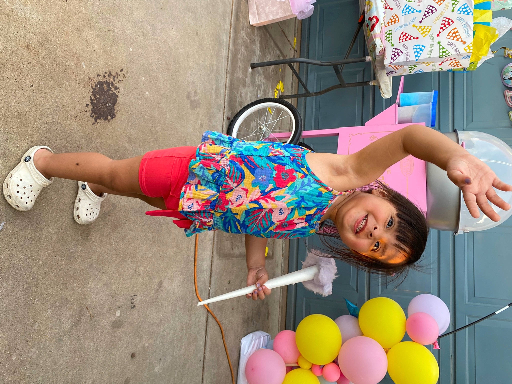Alize is registered to the contest to win money with this photo: balloon, child, dress, event, fun, green, happy, human_leg, joy, leisure, person, photograph, pink, sandal, shorts, snapshot, street_fashion, summer, thigh, tire
