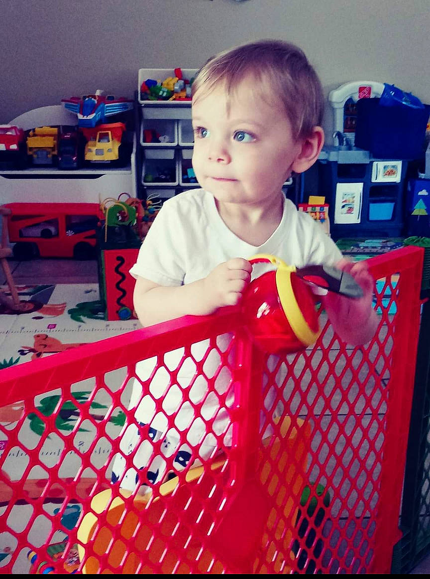 Lyncoln is registered to the contest to win money with this photo: baby, baby_products, baby_safety, baby_toys, child, person, play, product, red, room, shopping_cart, toddler, vehicle