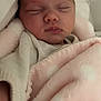 baby, newborn, sleeping, blanket, pink, polka_dot, face, closed_eyes, soft, cozy, infant, wrapped, bed, pale_skin, peaceful, clothing, cute, rest, young, portrait