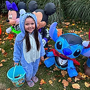 Tinley is registered to the contest to win money with this photo: child, girl, costume, onesie, halloween, candy_bucket, inflatable, mickey_mouse, minnie_mouse, stitch, grass, leaves, outdoor, smiling, holiday, festive, yard, autumn, fun, celebration