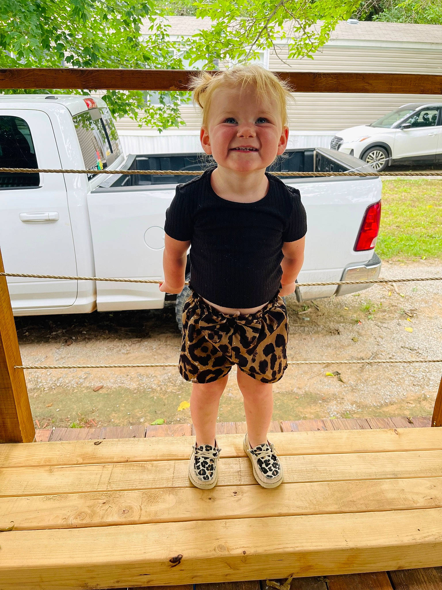 Brinley joined the competition — help win amazing prizes! car, glasses, grass, happy, joy, land_vehicle, leg, leisure, person, plant, shorts, smile, summer, sunglasses, t_shirt, tire, toddler, tree, vehicle, vehicle_door