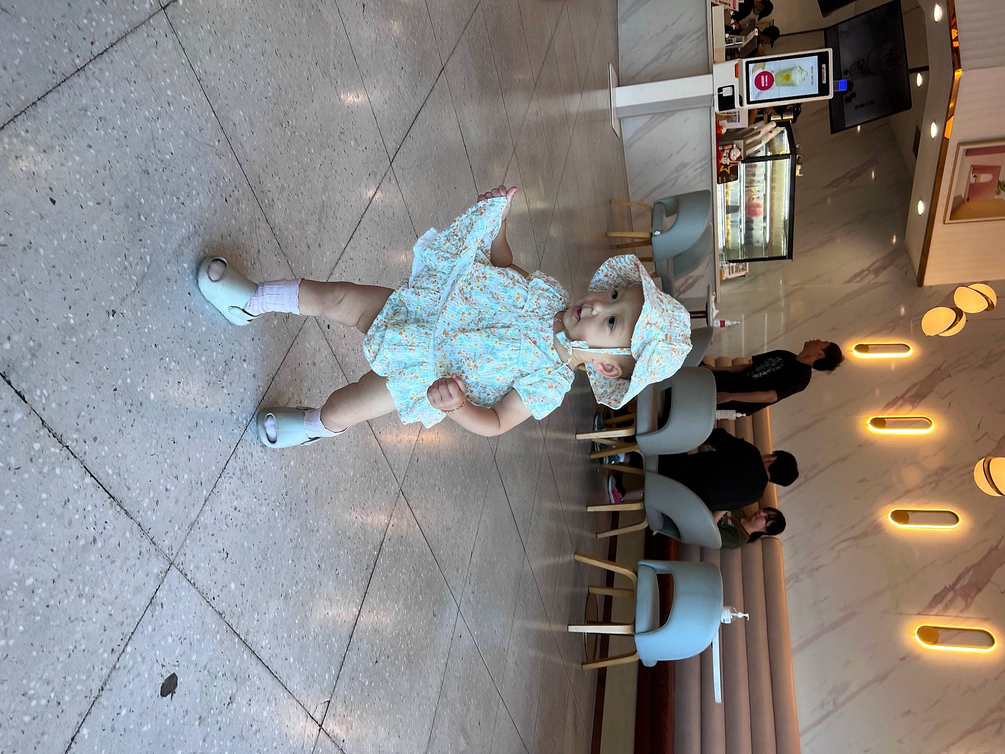 Joanne joined the competition — help win amazing prizes! aerospace_engineering, art, automotive_design, building, ceiling, city, engineering, flooring, fun, glass, headwear, human_leg, machine, metal, pedestrian, person, road_surface, shadow, sidewalk, space