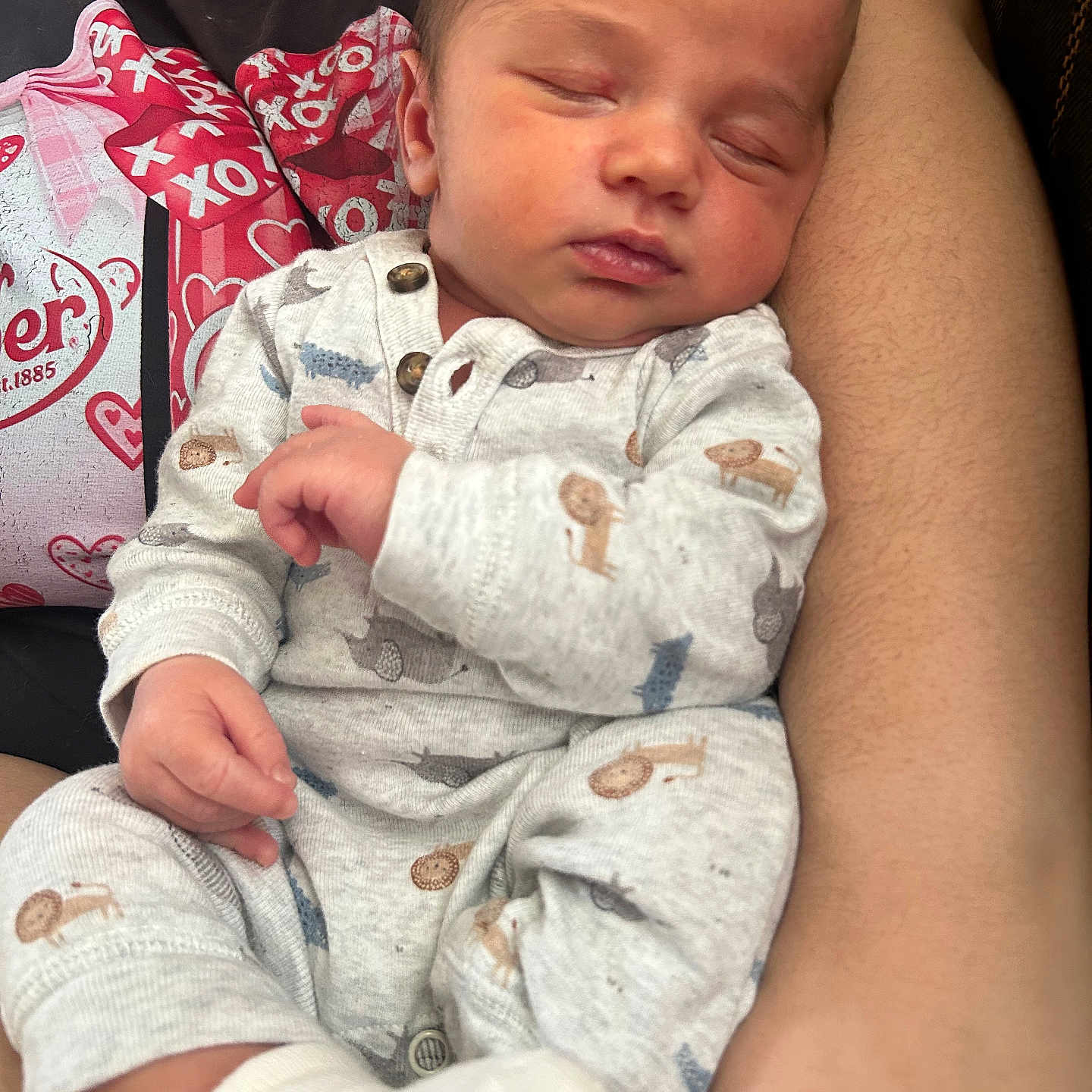 Koa joined the competition — help win amazing prizes! baby, sleeping, infant, onesie, animal_print, sock, arm, person, closeup, comfort, rest, cute, newborn, peaceful, cuddling, casual_clothing, indoor, portrait, tender, human