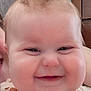 Ayda is registered to the contest to win money with this photo: baby, face, smile, cheeks, closeup, infant, skin, hair, person, child, cute, happy, expression, portrait, indoors, couch, furniture, human, joy, chubby