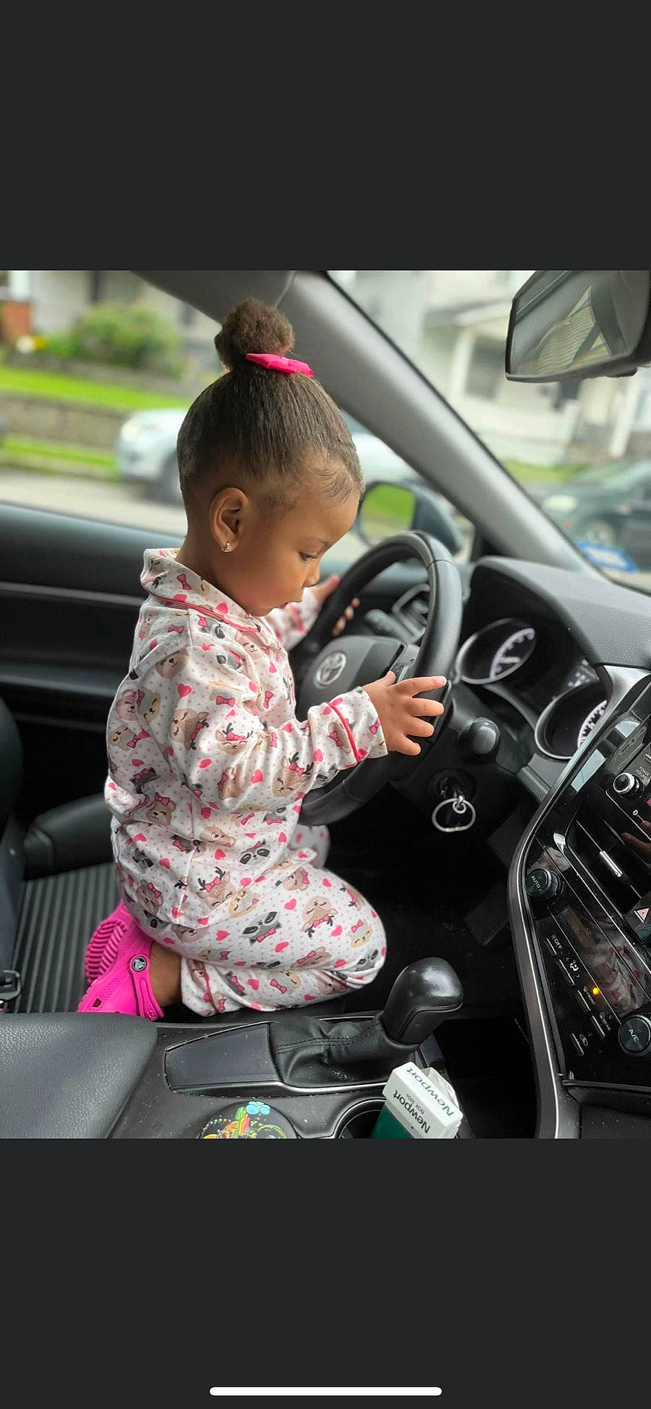 Aribella is registered to the contest to win money with this photo: auto_part, automotive_design, automotive_exterior, automotive_lighting, automotive_mirror, automotive_wheel_system, car, car_seat, fun, mode_of_transport, motor_vehicle, person, personal_luxury_car, plant, rear_view_mirror, steering_part, steering_wheel, toddler, vehicle, vehicle_door