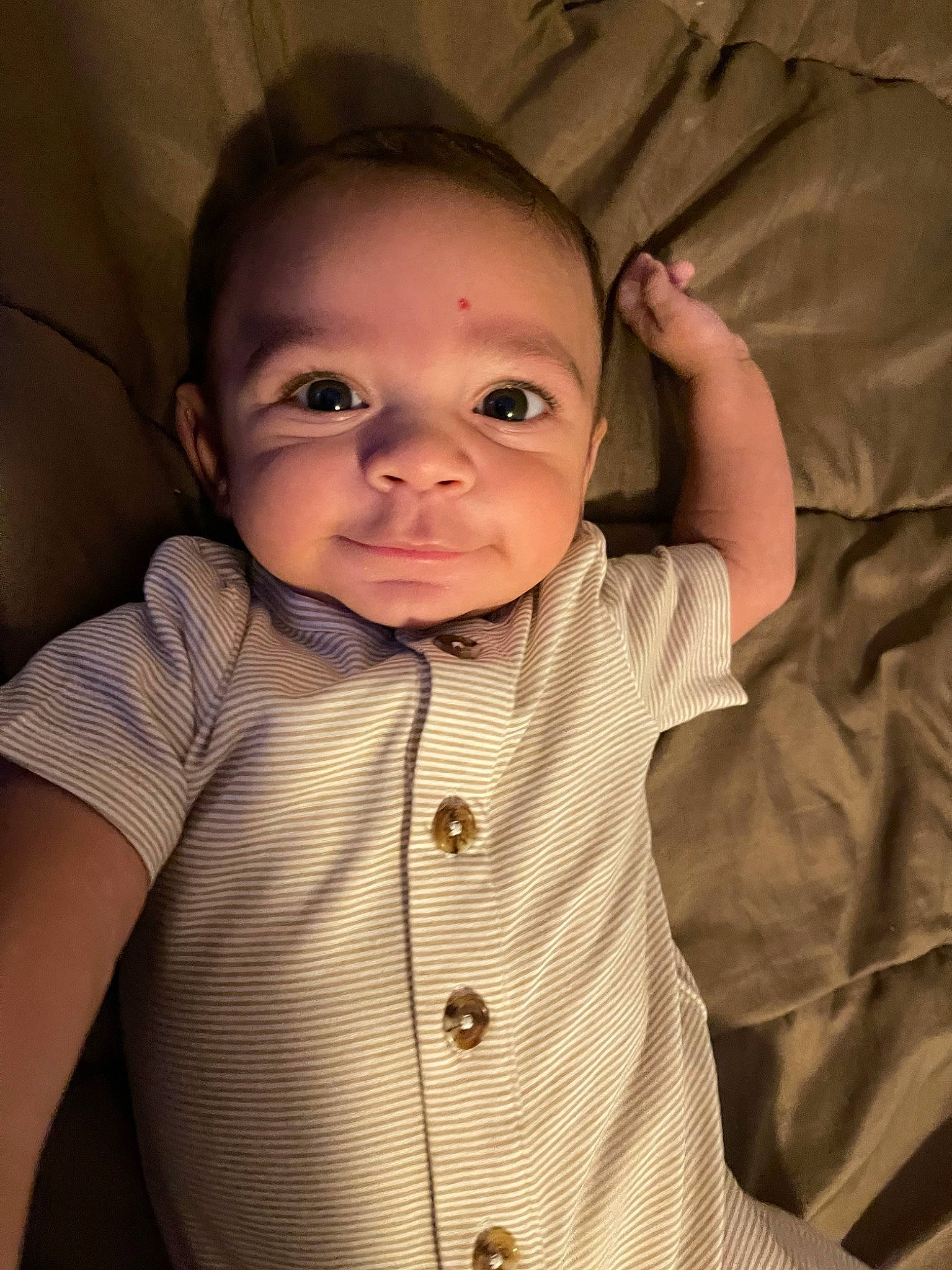 Asa is registered to the contest to win money with this photo: baby, baby_toddler_clothing, cheek, chin, collar, comfort, eyebrow, face, gesture, human_body, iris, lip, mouth, neck, nose, outerwear, person, skin, sleeve, smile