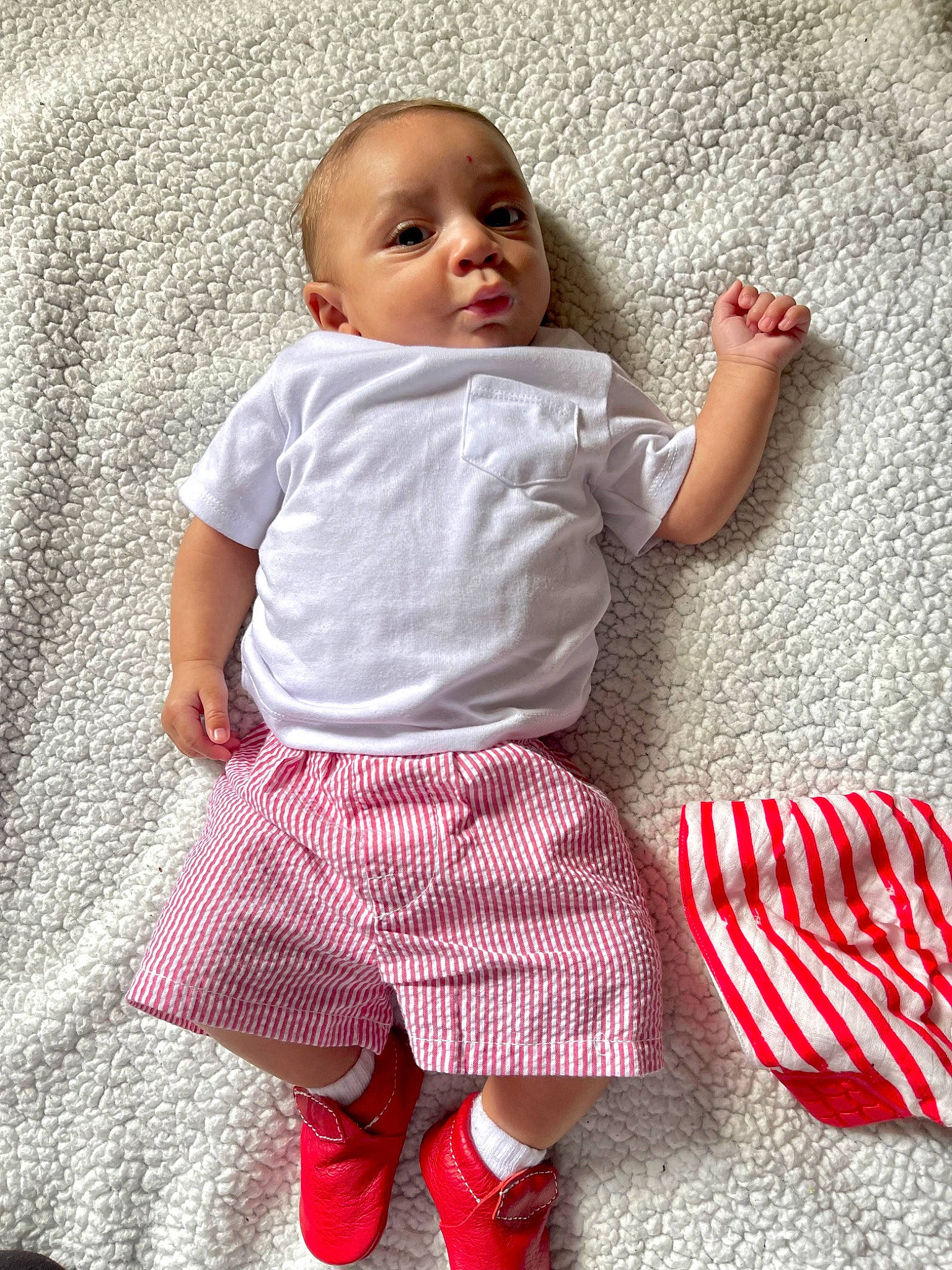 Asa joined the competition — help win amazing prizes! baby, baby_toddler_clothing, child, comfort, event, face, facial_expression, flag_of_the_united_states, happy, magenta, pattern, person, pink, plaid, product, sitting, sleeve, smile, t_shirt, textile