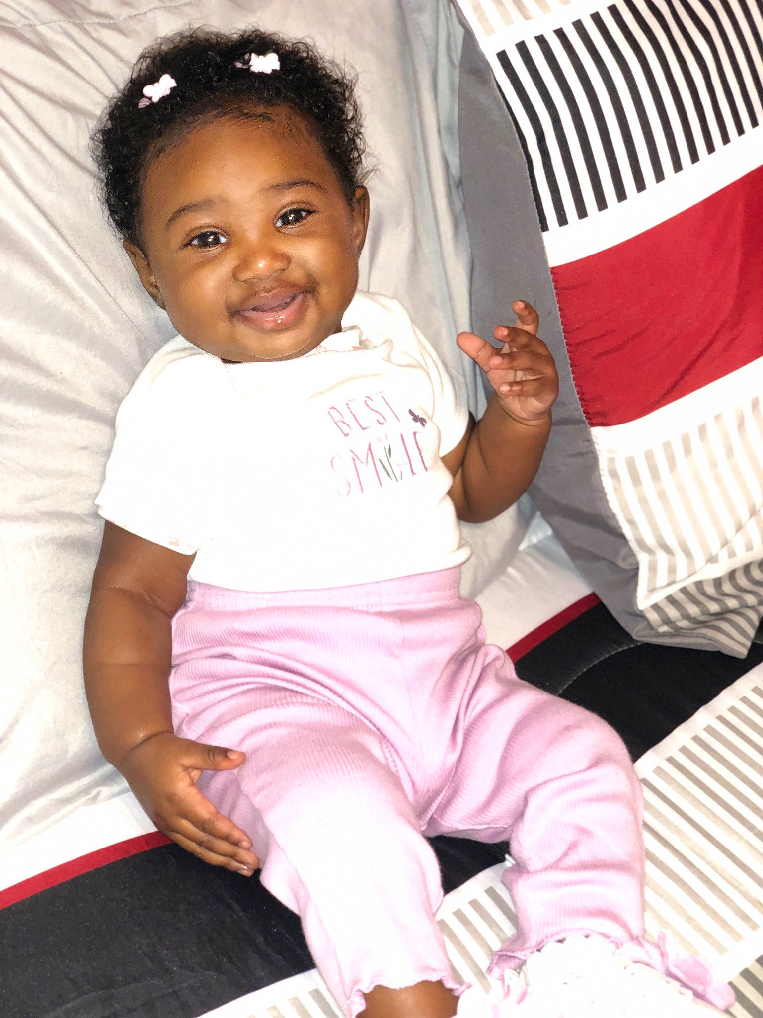 Hadiya joined the competition — help win amazing prizes! baby, baby_toddler_clothing, cheek, child, comfort, happy, human_leg, joy, knee, leisure, magenta, person, pink, product, shoulder, sitting, sleeve, smile, t_shirt, thigh