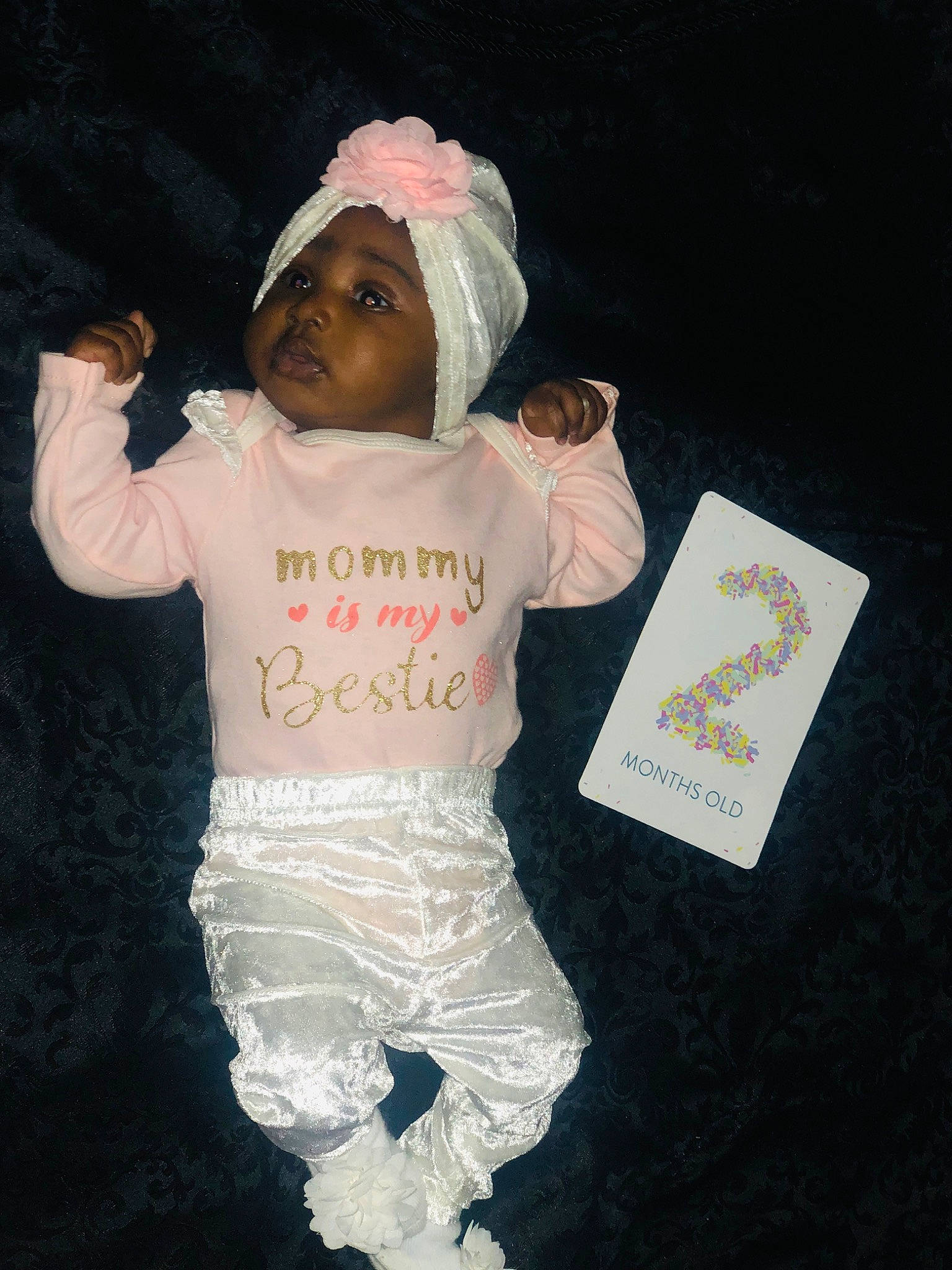 Hadiya is registered to the contest to win money with this photo: baby, baby_toddler_clothing, cap, child, cool, costume, event, facial_expression, font, fun, gesture, happy, hat, headwear, outerwear, person, pink, product, sleeve, t_shirt