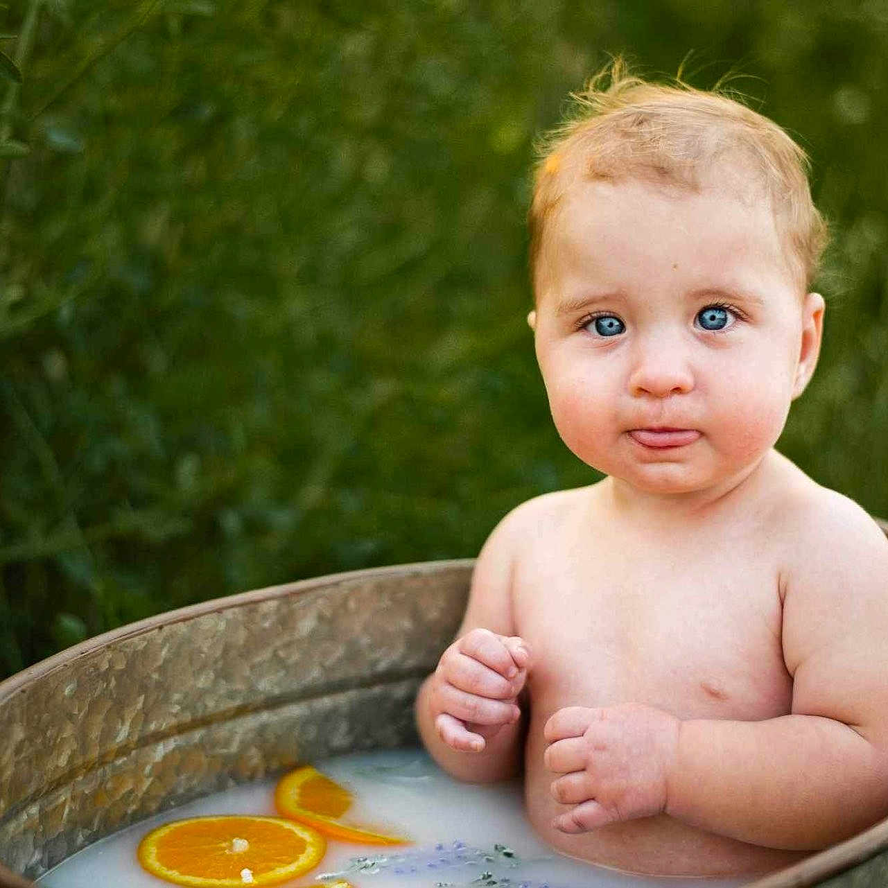 Mathena is registered to the contest to win money with this photo: baby, bathing, bodypart, citrusfruit, face, finger, food, fruit, hand, happy, head, herbal, herbs, person, photography, plant, portrait, pottedplant, sitting, smile