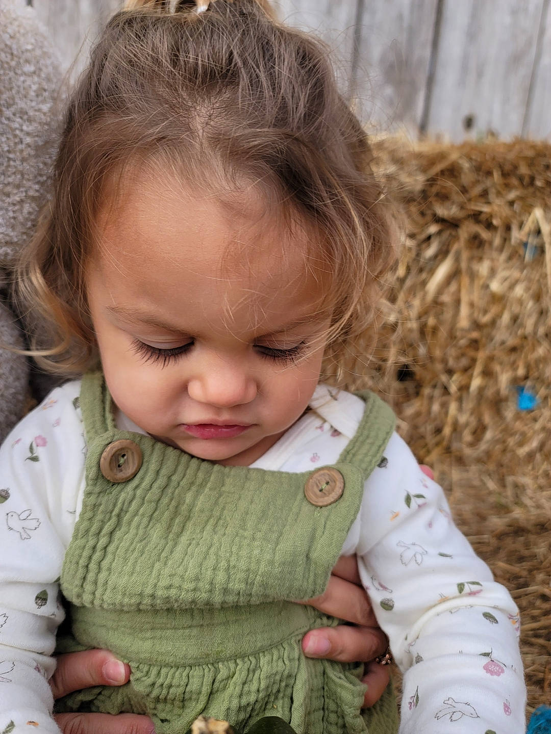 Raylynn is registered to the contest to win money with this photo: baby, baby_toddler_clothing, cheek, chin, clothing, eye, eyelash, face, facial_expression, grass, hand, happy, head, human, iris, lip, nose, person, skin, sleeve