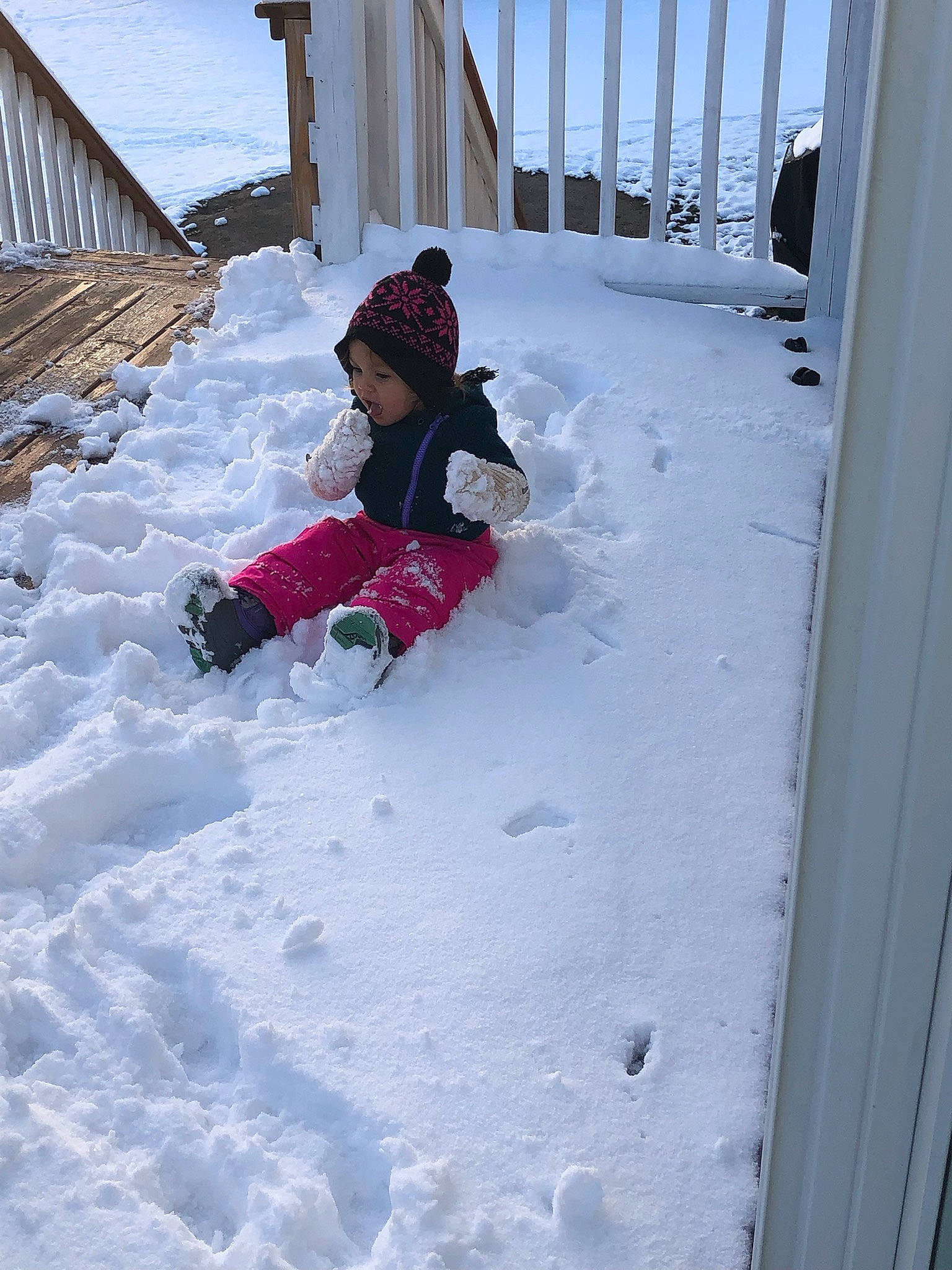 Raylynn is registered to the contest to win money with this photo: baby, child, freezing, fun, hat, headwear, ice_cap, leisure, magenta, person, playing_in_the_snow, precipitation, recreation, sky, slope, snow, toddler, winter, winter_storm