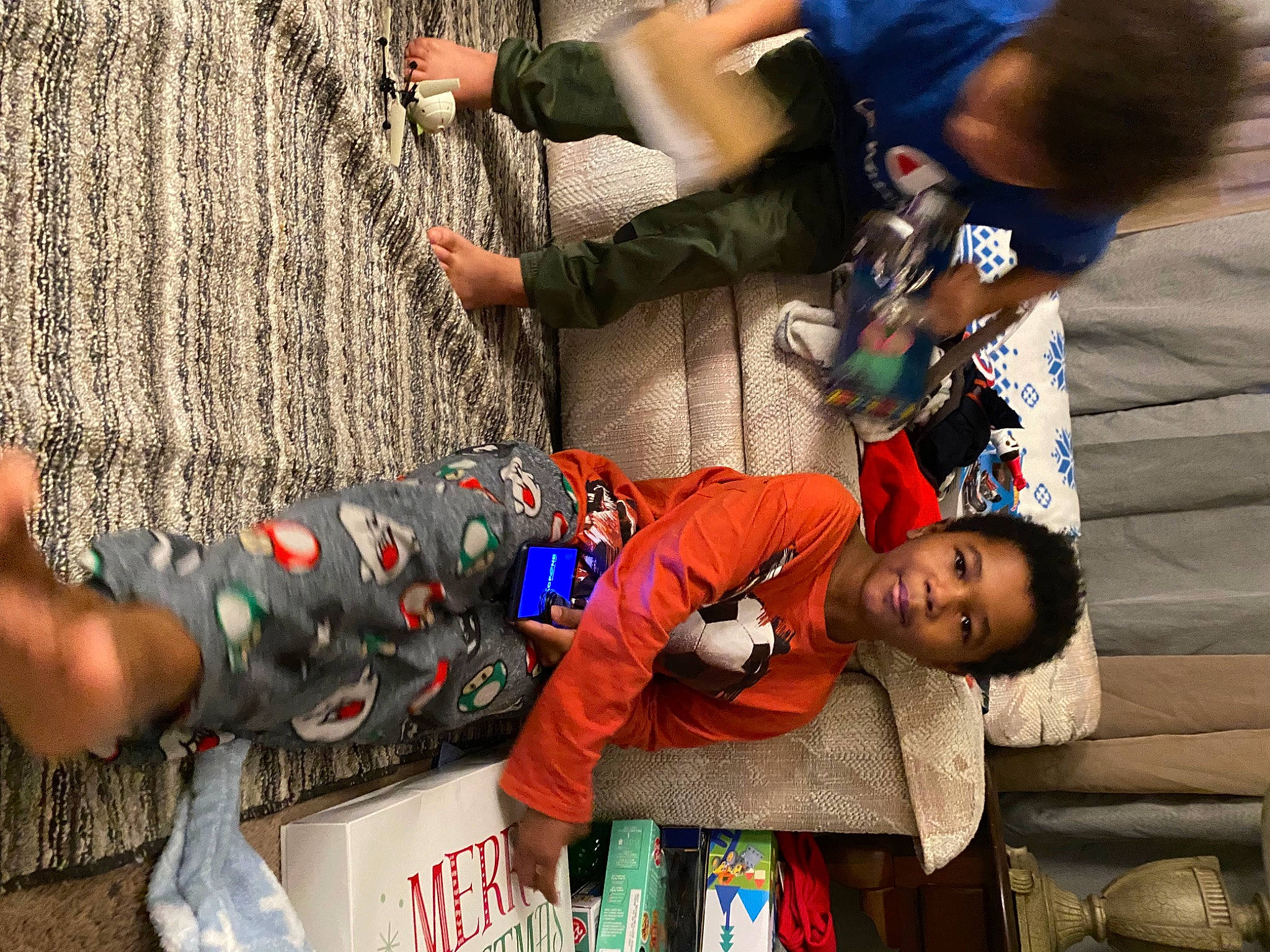 King is registered to the contest to win money with this photo: adaptation, arm, child, event, facial_expression, fun, gesture, hand, happy, interaction, joint, joy, leisure, person, photograph, recreation, sitting, snapshot, temple, toddler