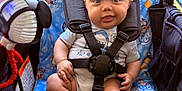 Elias joined the competition — help win amazing prizes! baby, child, stroller, bluey, cartoon, toy, mickey_mouse, seat, harness, clothing, smiling, tongue_out, cute, indoor, infant, colorful, playful, happy, closeup, person