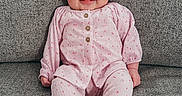 Emma-Rose joined the competition — help win amazing prizes! baby, child, infant, smiling, happy, portrait, sitting, couch, furniture, pink_outfit, clothing, onesie, long_sleeves, barefoot, feet, indoor, home, closeup, adorable, photography