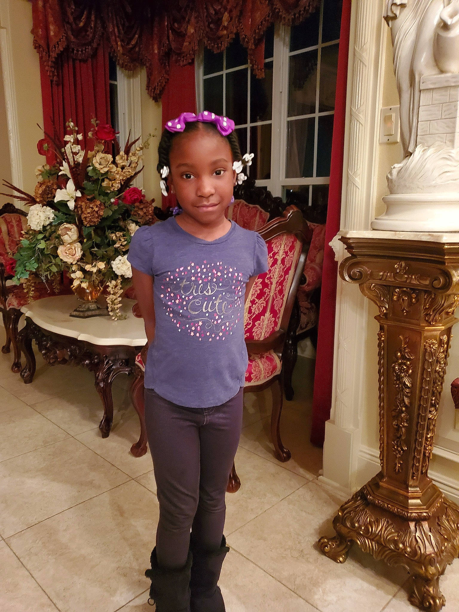 Geniyah is registered to the contest to win money with this photo: child, fashion_accessory, person, shoulder, smile, standing, temple, trousers