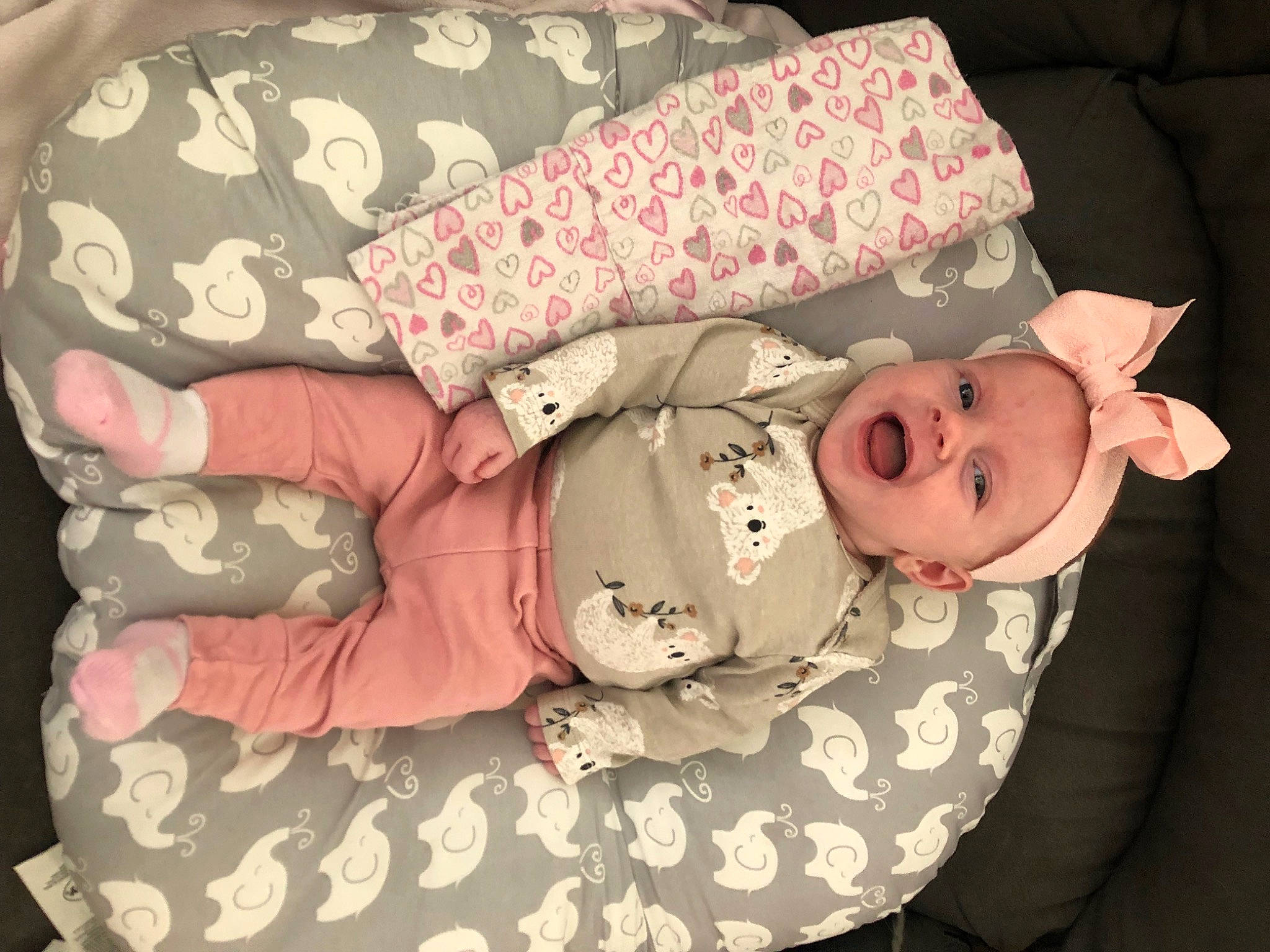 Eva joined the competition — help win amazing prizes! baby, baby_products, baby_sleeping, baby_toddler_clothing, bedding, child, collar, comfort, fashion_accessory, hat, linens, pattern, person, pink, product, room, skin, sleeve, smile, textile