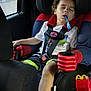 Mateo joined the competition — help win amazing prizes! balloon, black_shorts, car, car_interior, car_seat, child, curly_hair, daytime, fast_food, happy_meal, kid, peaceful, rain, red_cup_holder, resting, seatbelt, sleeping, toy, white_tshirt, window