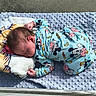baby, bed, blanket, child, cozy, curled_up, indoor, infant, lying_down, mickey_mouse, nap, newborn, pajamas, peaceful, pillow, plush_toy, portrait, sleeping, soft_blanket, textile