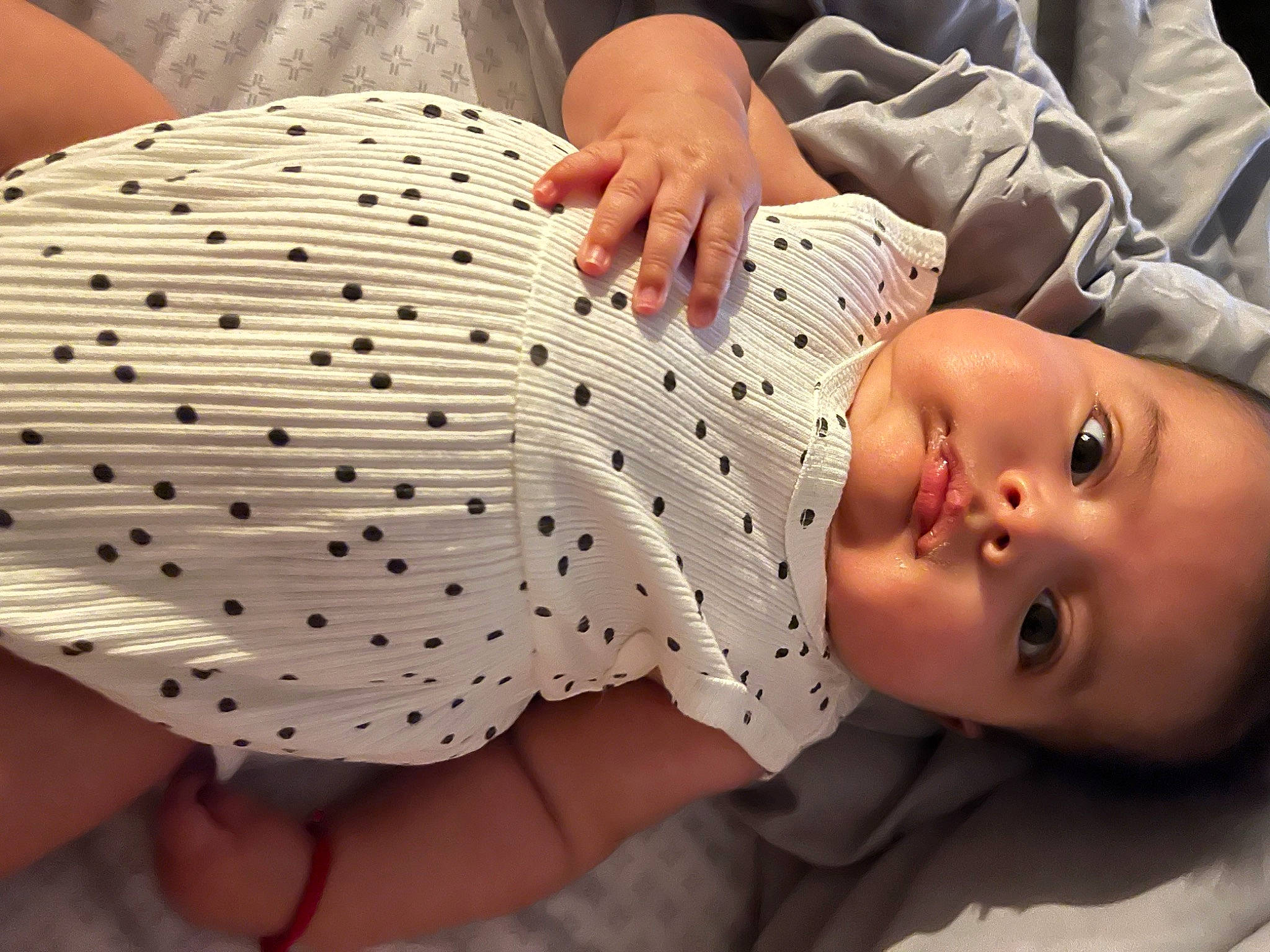 Lila joined the competition — help win amazing prizes! abdomen, baby, baby_products, baby_toddler_clothing, child, comfort, finger, foot, gesture, headgear, linens, nail, pattern, person, sleeve, thigh, thumb, toddler, vertebrate, white