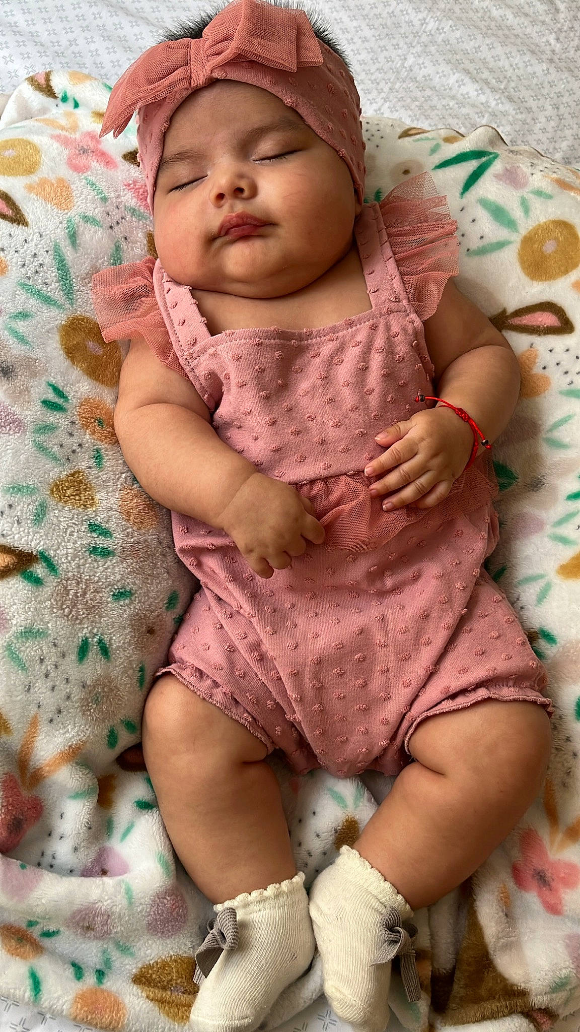 Lila is registered to the contest to win money with this photo: baby, baby_sleeping, baby_toddler_clothing, cap, cheek, child, comfort, eye, face, head, headwear, human_body, linens, magenta, pattern, person, pink, skin, sleeve, textile