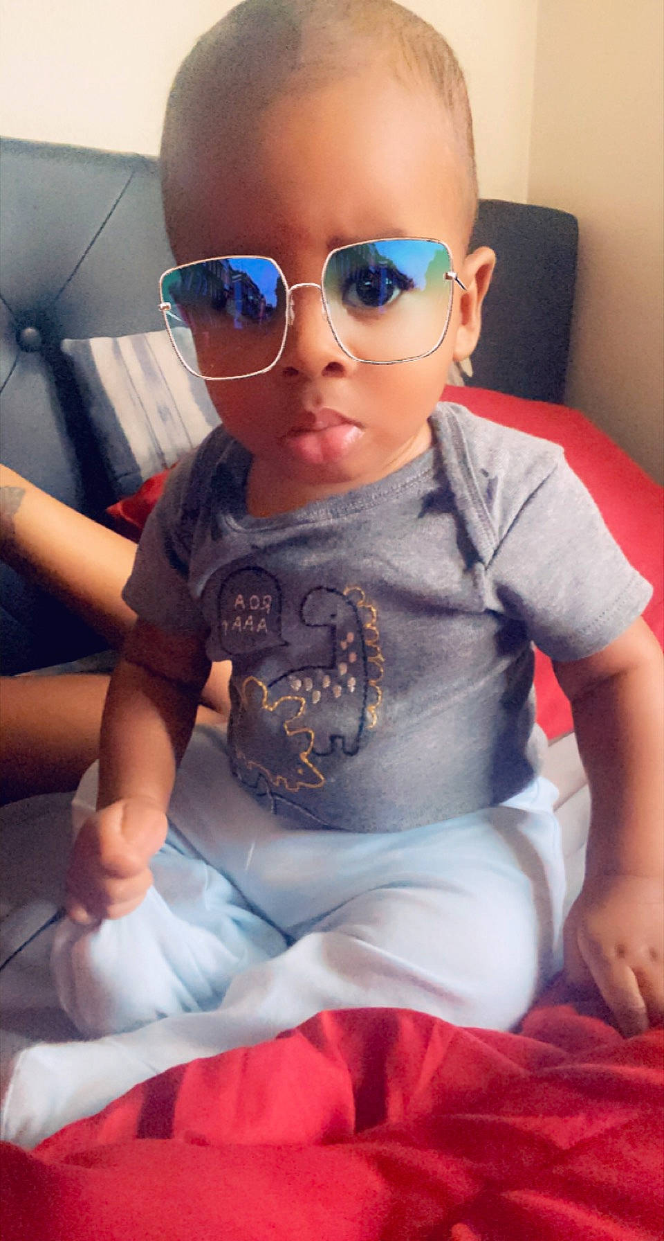 Lawrence is registered to the contest to win money with this photo: baby, baby_toddler_clothing, blue, child, cool, dress, eyewear, fun, glasses, goggles, head, lip, nose, person, pink, skin, sleeve, sunglasses, toddler, vision_care