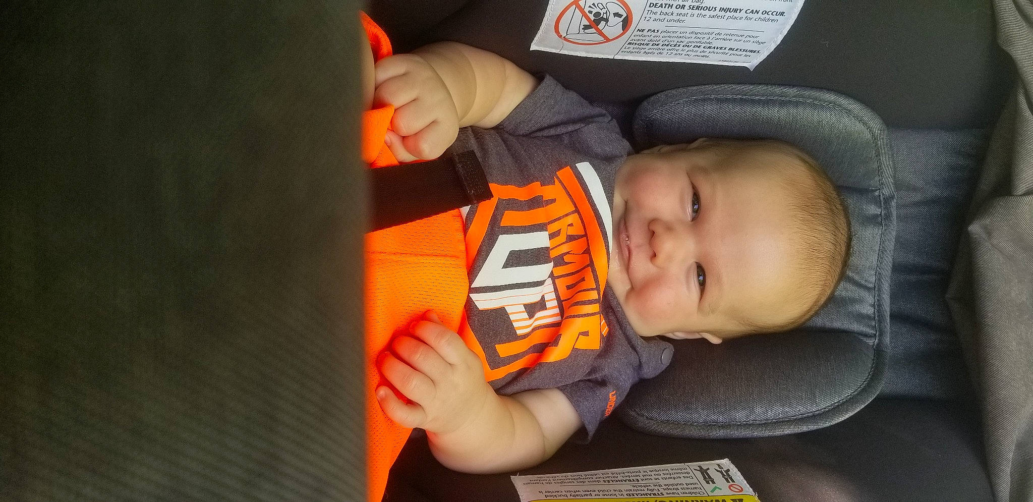 Arlow is registered to the contest to win money with this photo: baby, baby_carriage, baby_products, baby_toddler_clothing, cap, car_seat, carmine, cheek, child, comfort, finger, fun, hand, hat, mouth, nail, nose, orange, person, thumb