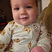 Maverick joined the competition — help win amazing prizes! baby, bodypart, clothing, couch, face, finger, furniture, hand, happy, head, homedecor, indoors, laughing, mouth, pajamas, person, photography, portrait, quilt, smile