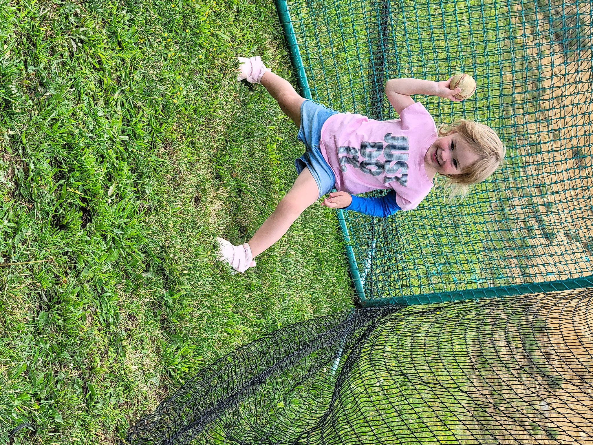 Kelsi joined the competition — help win amazing prizes! barefoot, flooring, fun, garden, grass, grassland, groundcover, happy, joy, lawn, leisure, mesh, net, people_in_nature, person, plant, recreation, shadow, shorts, shrub