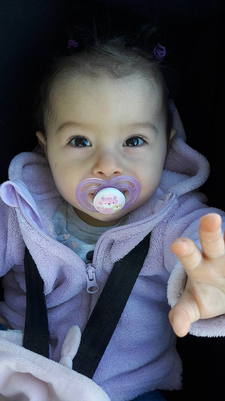 Lana participe au concours pour gagner de l'argent avec cette photo : baby, baby_products, baby_toddler_clothing, cheek, child, collar, eyebrow, eyelash, finger, gesture, happy, head, iris, lip, mouth, nose, outerwear, person, skin, sleeve