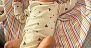 Jha Lani joined the competition — help win amazing prizes! baby, newborn, infant, child, portrait, face, lying_down, sleepwear, headband, bow, leopard_print, booties, striped_blanket, cushion, baby_clothing, stars, indoor, home, carpet, toys
