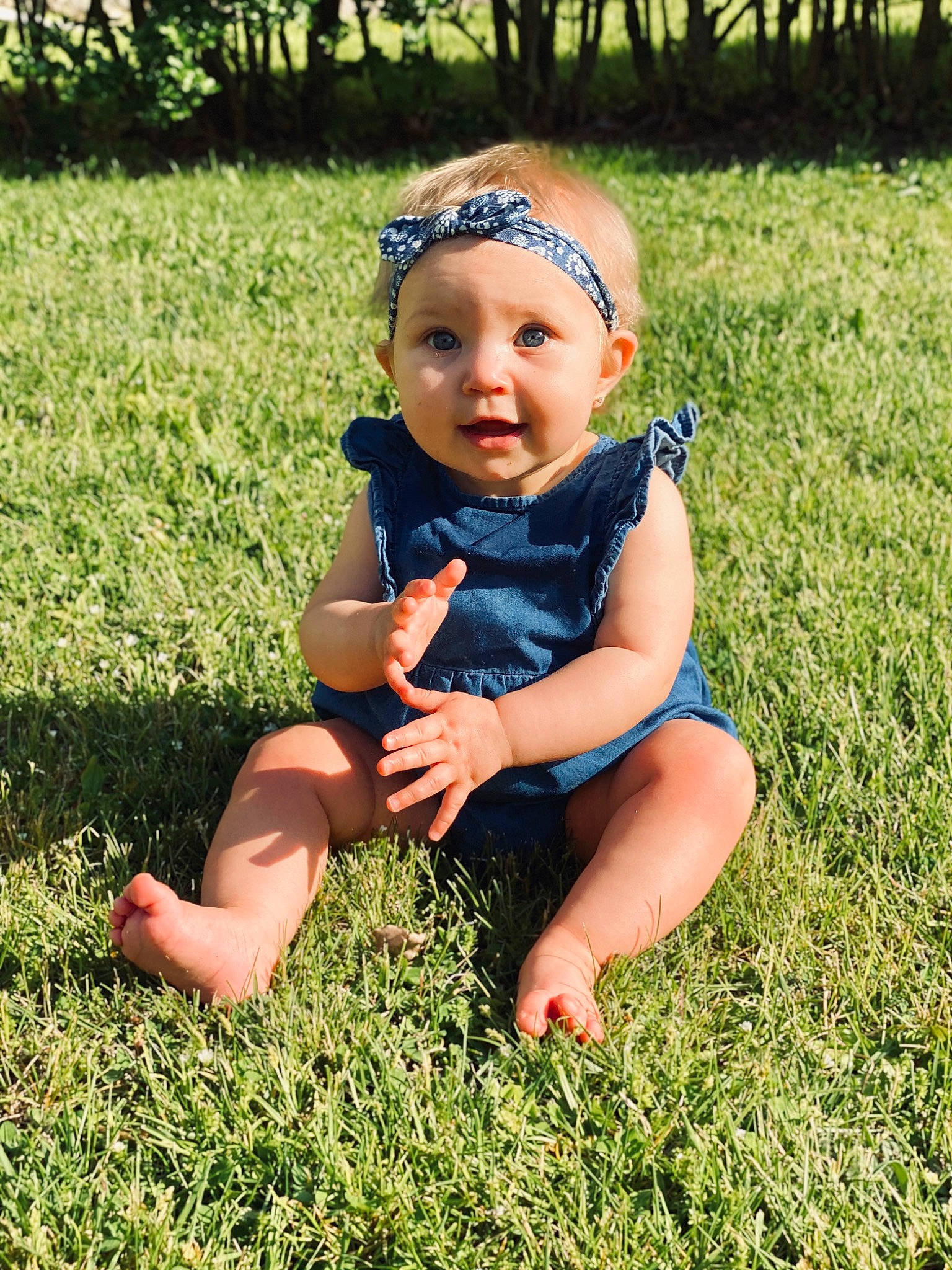 Stevie joined the competition — help win amazing prizes! baby, baby_toddler_clothing, child, finger, fun, grass, grass_family, hand, happy, headgear, headwear, lawn, leg, meadow, people_in_nature, person, plant, sitting, skin, smile