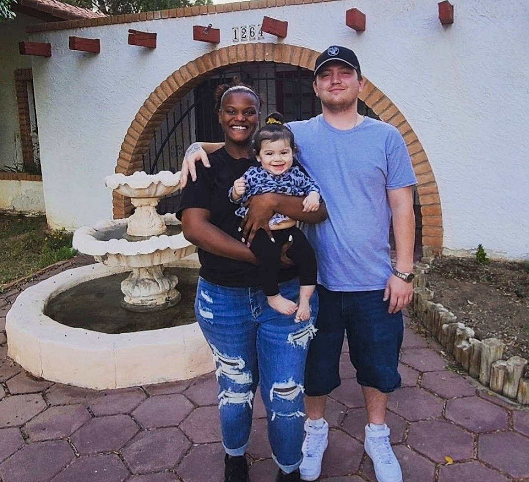 Adelynn is registered to the contest to win money with this photo: architecture, building, event, fountain, fun, happy, hat, headwear, house, joy, landscape, leg, leisure, person, plant, shorts, smile, snapshot, social_group, t_shirt