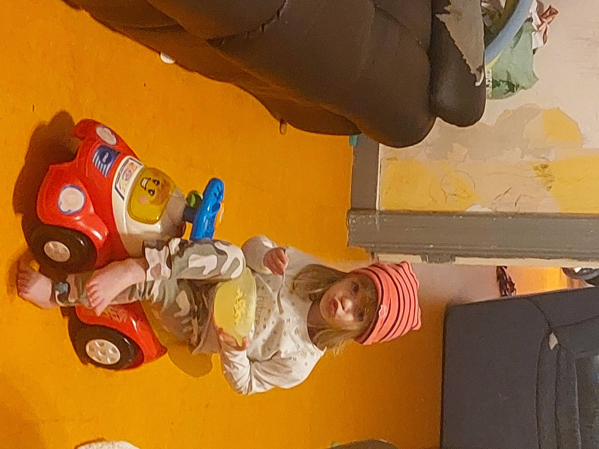 Ophelie a rejoint le concours — aidez-le/la à gagner de superbes lots ! animation, art, automotive_design, carmine, ceiling, child, fictional_character, fun, gesture, headwear, person, room, smile, space, tire, toddler, toy, visual_arts, wheel