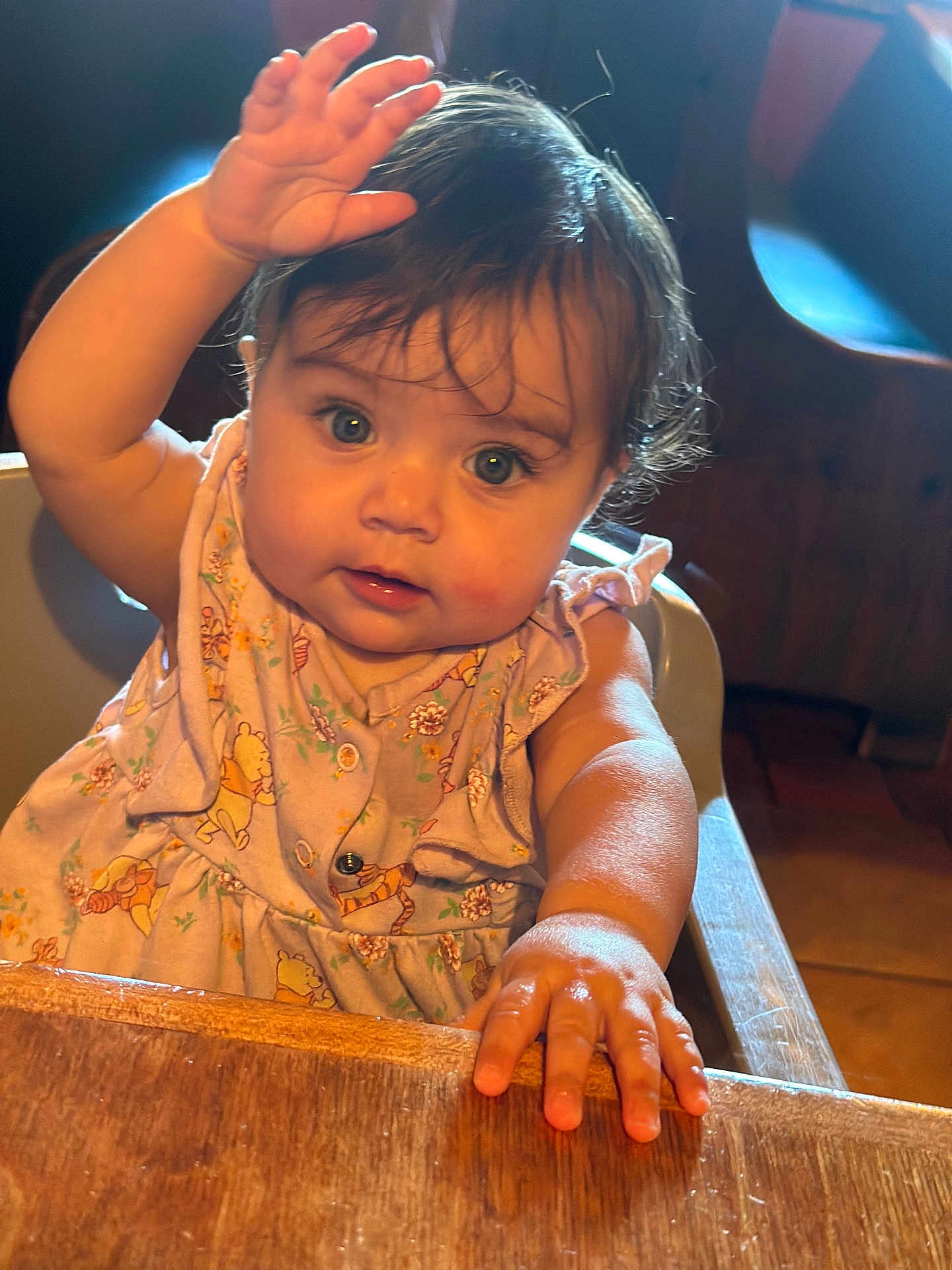 Eleanor joined the competition — help win amazing prizes! baby, child, cute, blue_eyes, dress, hand, wooden_table, curious, indoor, high_chair, soft_light, portrait, infant, furniture, person, skin, hair, closeup, expression, table
