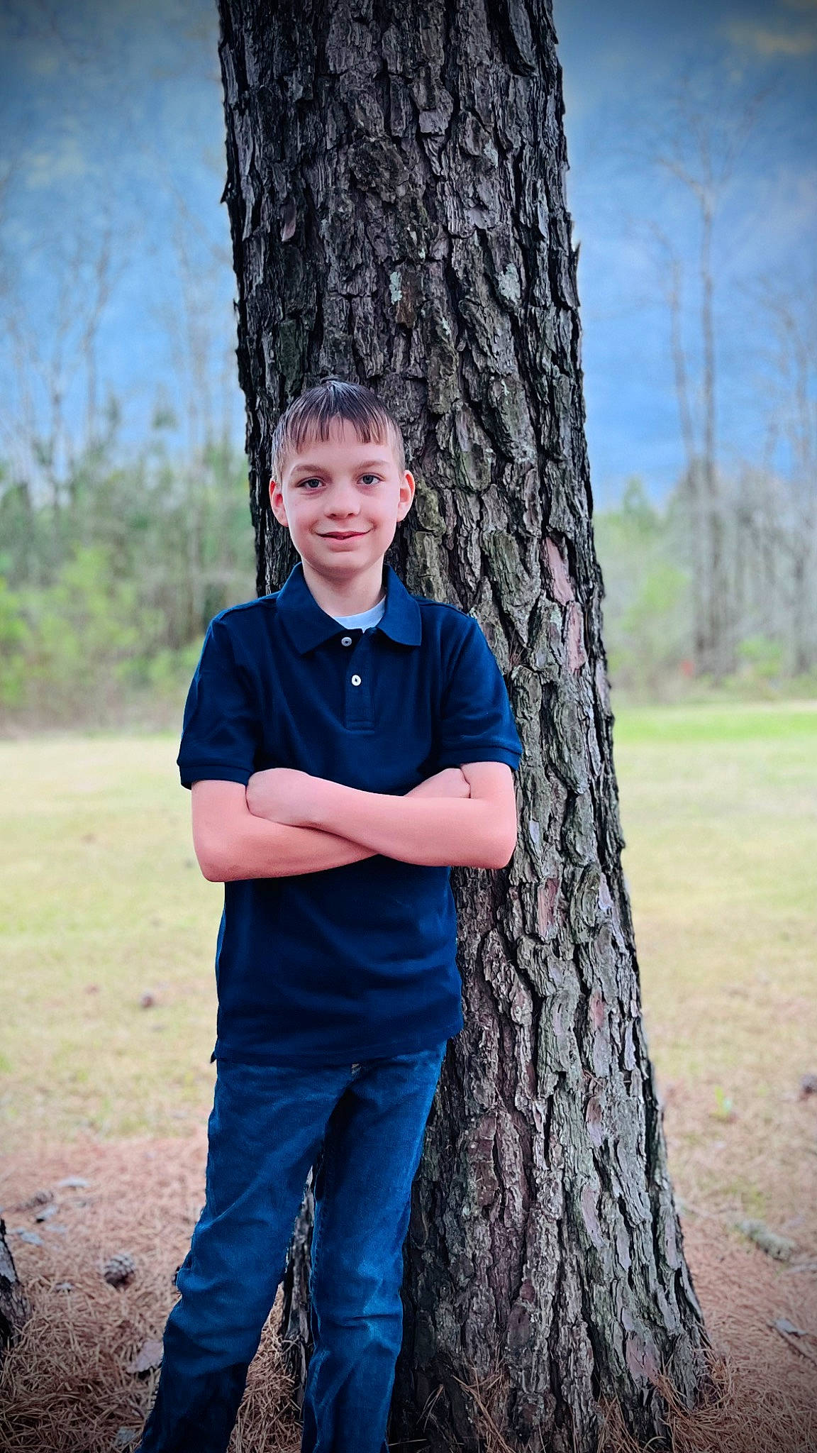 Braxton joined the competition — help win amazing prizes! branch, elbow, electric_blue, flash_photography, fun, gesture, grass, happy, jeans, joy, people_in_nature, person, plant, shoulder, sky, sleeve, smile, tree, trunk, wood