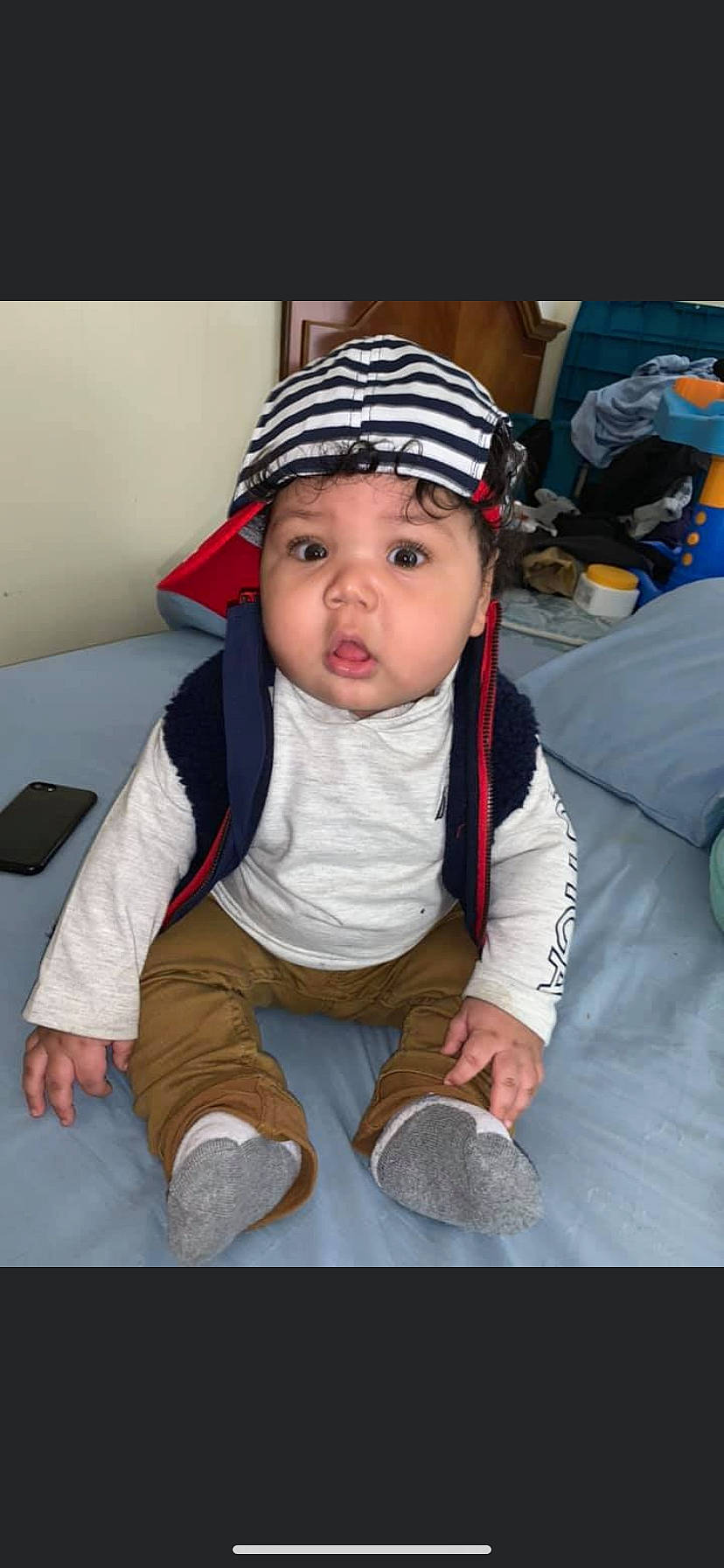 Sekani is registered to the contest to win money with this photo: baby, child, headgear, headwear, person, toddler