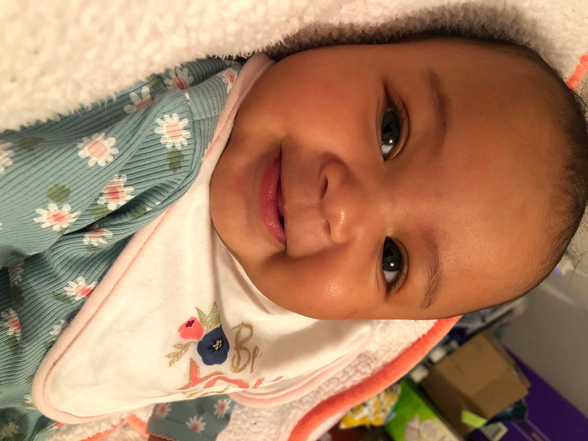 Esme is registered to the contest to win money with this photo: baby, cheek, chin, clothing, eyebrow, eyelash, facial_expression, forehead, hair, happy, iris, joy, lip, mouth, nose, person, product, skin, sleeve, smile