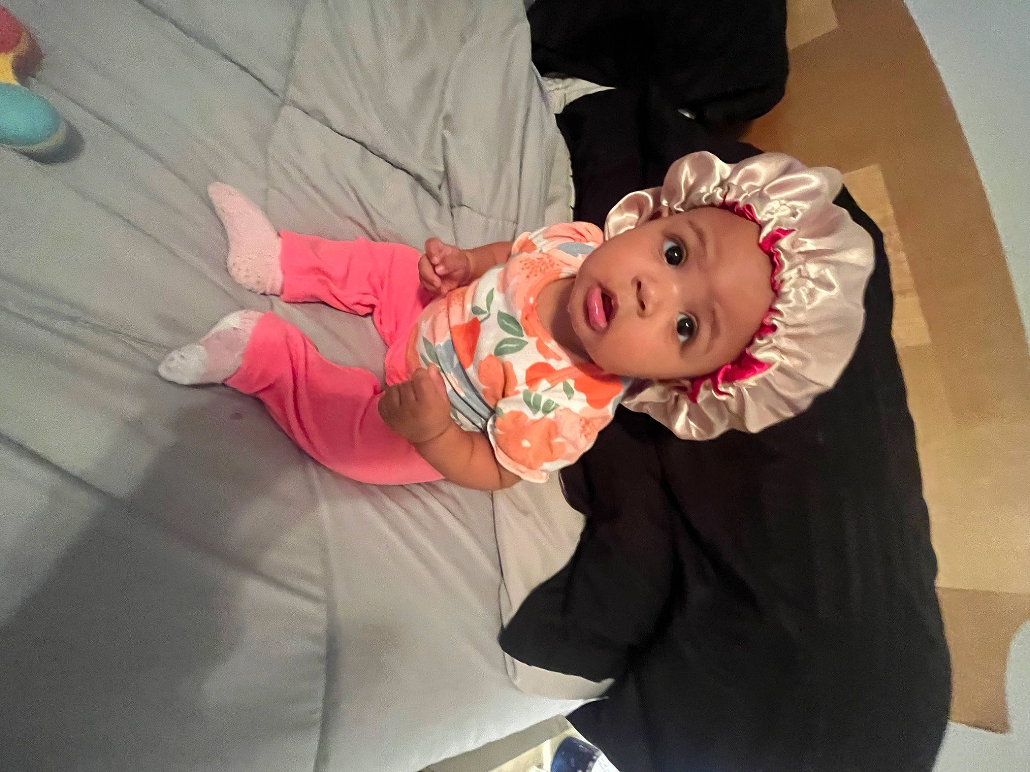 Esme is registered to the contest to win money with this photo: baby, baby_toddler_clothing, cheek, child, comfort, costume, event, flooring, foot, fun, happy, hat, headwear, person, room, sitting, sleeve, smile, suit, surprise