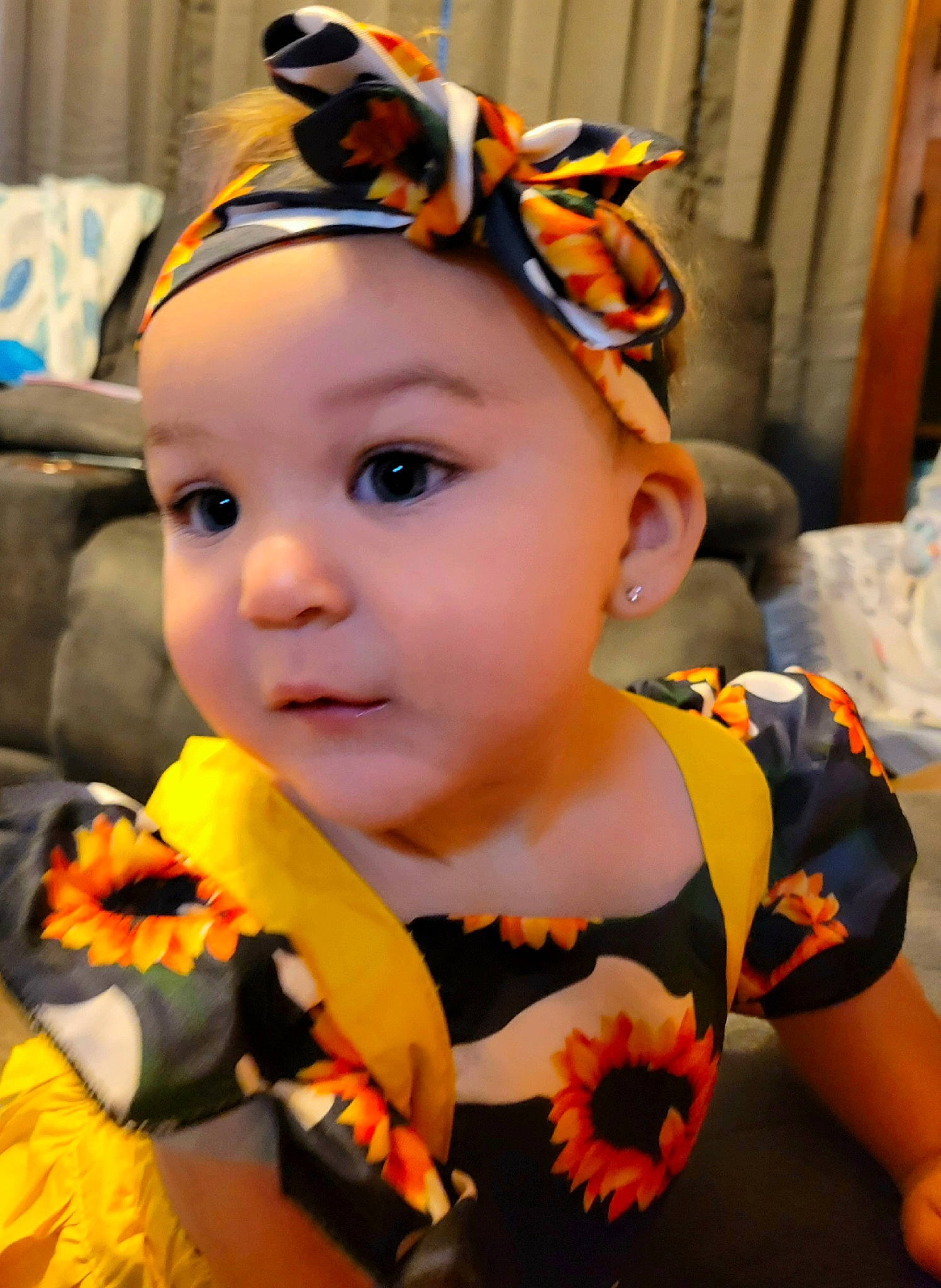 Blakely is registered to the contest to win money with this photo: baby, baby_toddler_clothing, cap, child, event, eye, eyewear, facial_expression, fashion_accessory, fun, happy, hat, head, headwear, helmet, human_body, orange, person, personal_protective_equipment, plant