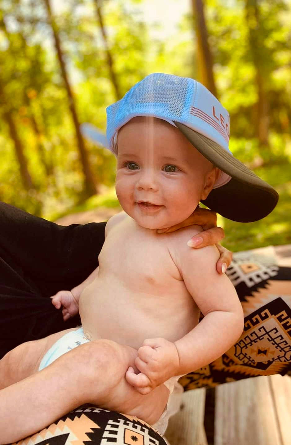 Cannon is registered to the contest to win money with this photo: arm, baby, baseball_cap, cap, child, finger, fun, grass, hand, happy, hat, headwear, jewellery, joy, leisure, muscle, people_in_nature, person, recreation, smile