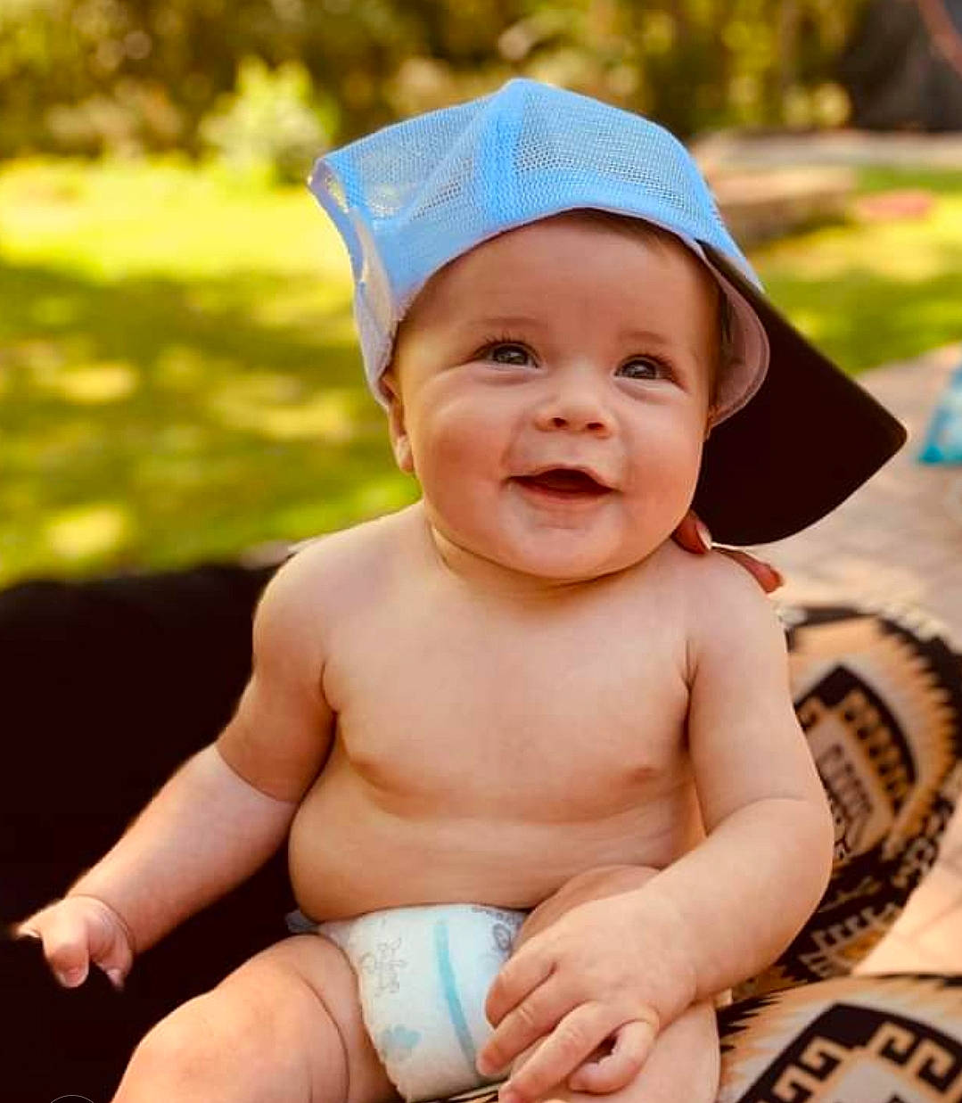 Cannon joined the competition — help win amazing prizes! baby, baby_toddler_clothing, cap, child, eye, facial_expression, finger, gesture, grass, hand, happy, hat, headwear, muscle, nail, people_in_nature, person, skin, smile, thumb