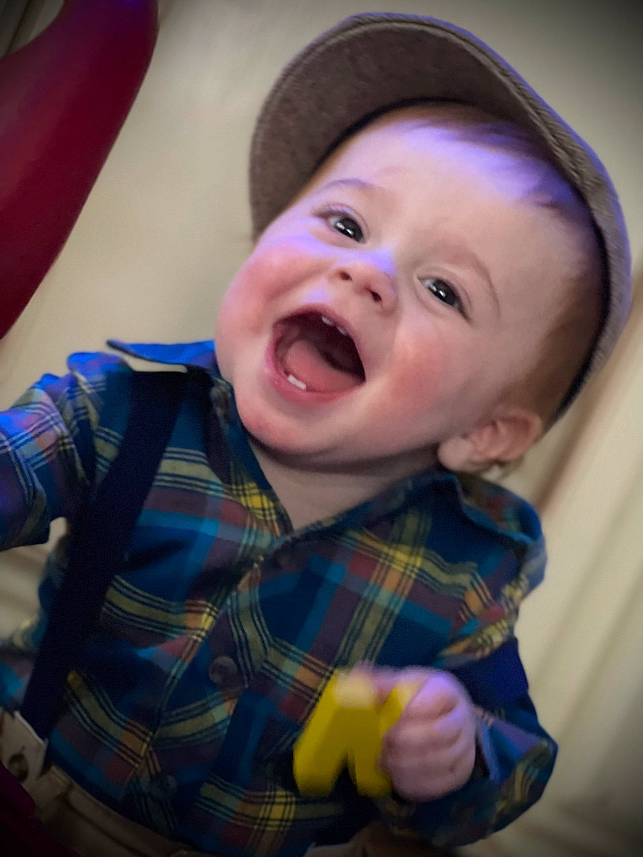 Jaxson is registered to the contest to win money with this photo: baby, baby_laughing, cheek, eye, facial_expression, flash_photography, fun, happy, helmet, iris, lip, mouth, nose, person, pink, purple, skin, smile, tartan, toddler