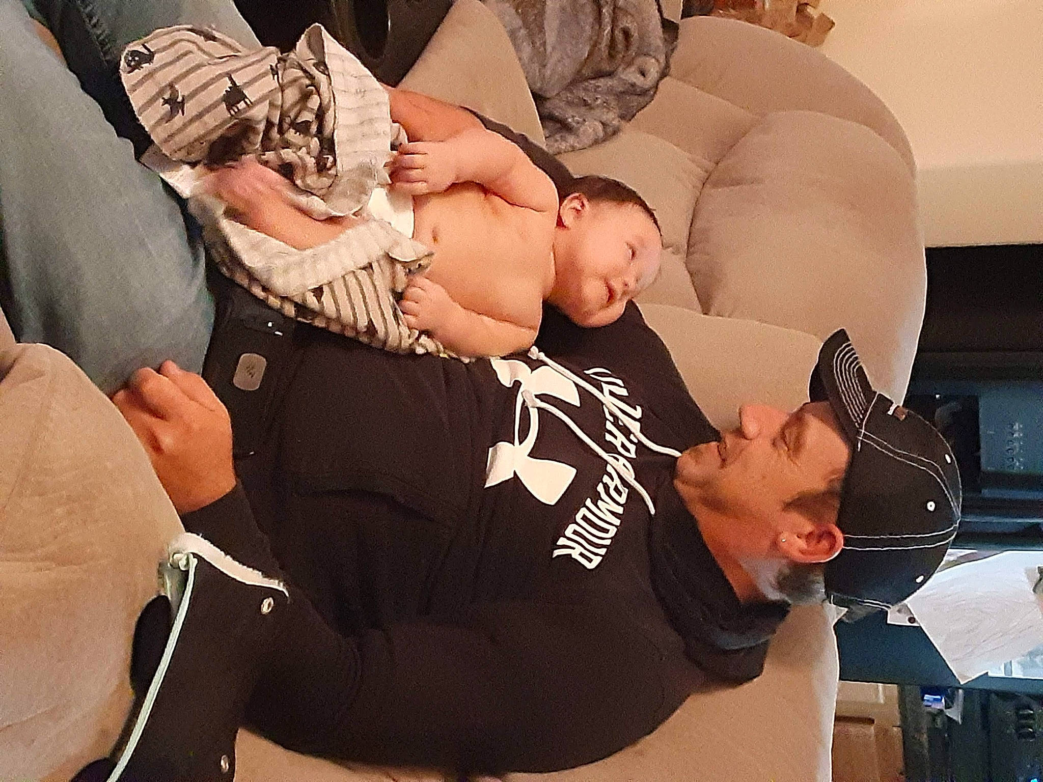 Zealand joined the competition — help win amazing prizes! abdomen, baby, chest, comfort, elbow, event, eyewear, flash_photography, fun, gesture, hat, headwear, human_leg, person, shoulder, sitting, t_shirt, tattoo, thigh, toddler