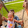 Xiomora is registered to the contest to win money with this photo: toddler, child, swing, playground, adult, holding_hands, happy, smiling, outdoor, grass, park, daylight, trees, clothing, tattoo, person, fun, joy, playing, urban
