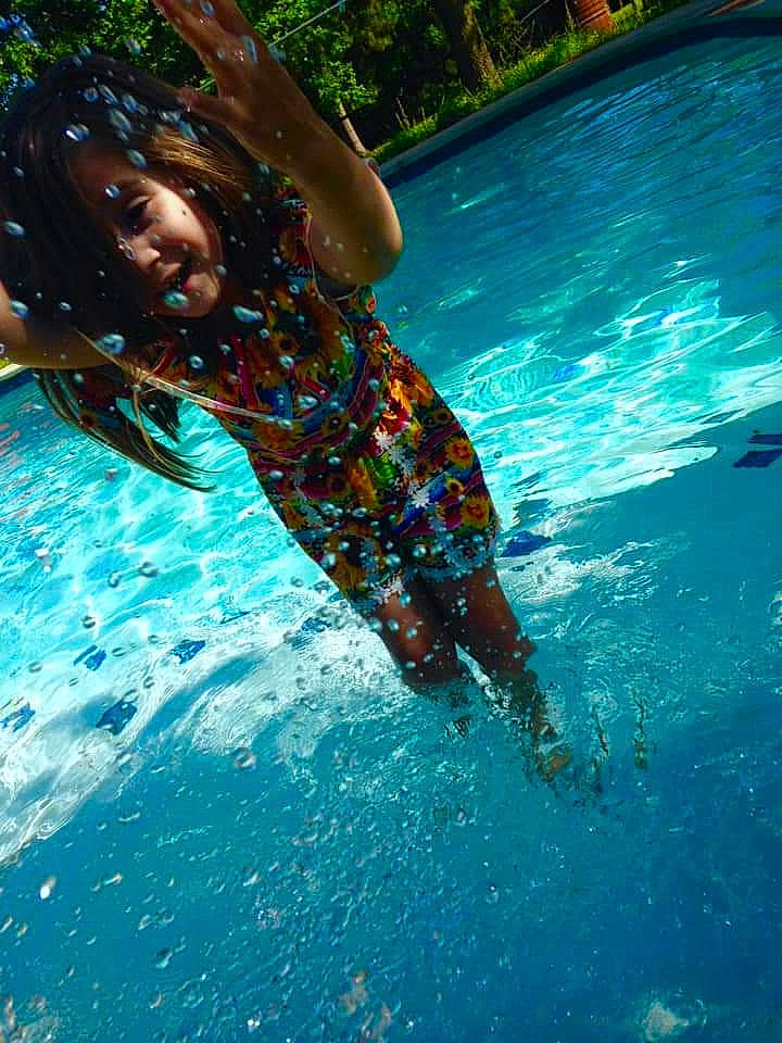 Alexys is registered to the contest to win money with this photo: blue, electric_blue, fish, fun, grass, happy, jumping, leisure, leisure_centre, people_in_nature, person, personal_protective_equipment, plant, play, recreation, swimming_pool, swimwear, thigh, toddler, vacation