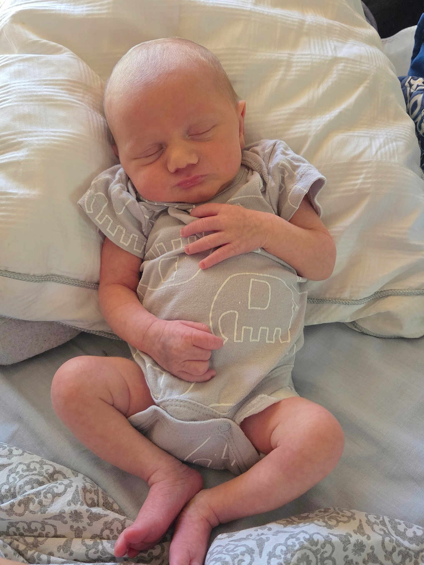 Elliot joined the competition — help win amazing prizes! newborn, baby, sleeping, infant, onesie, elephant_pattern, bed, pillow, blanket, soft, cute, peaceful, small_hands, legs, resting, indoors, cozy, child, portrait, person