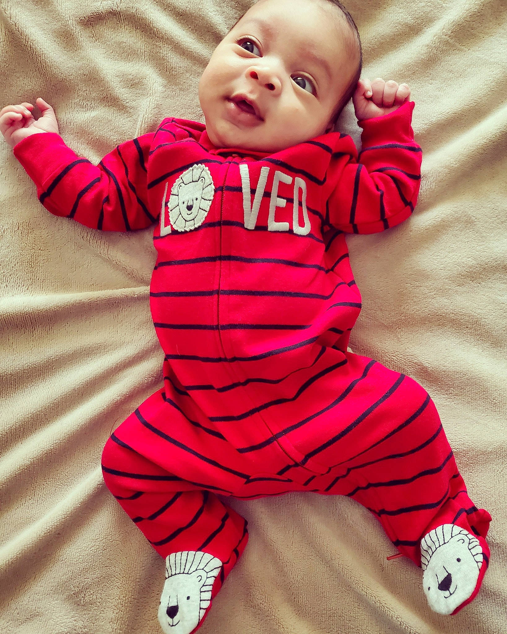 Nehemiah is registered to the contest to win money with this photo: baby, baby_toddler_clothing, cheek, comfort, eye, face, gesture, happy, head, human_body, magenta, person, pink, red, skin, sleeve, smile, sportswear, t_shirt, toddler